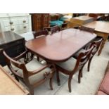 A REGENCY STYLE EXTENDING DINING TABLE AND SIX ROPE BACK DINING CHAIRS