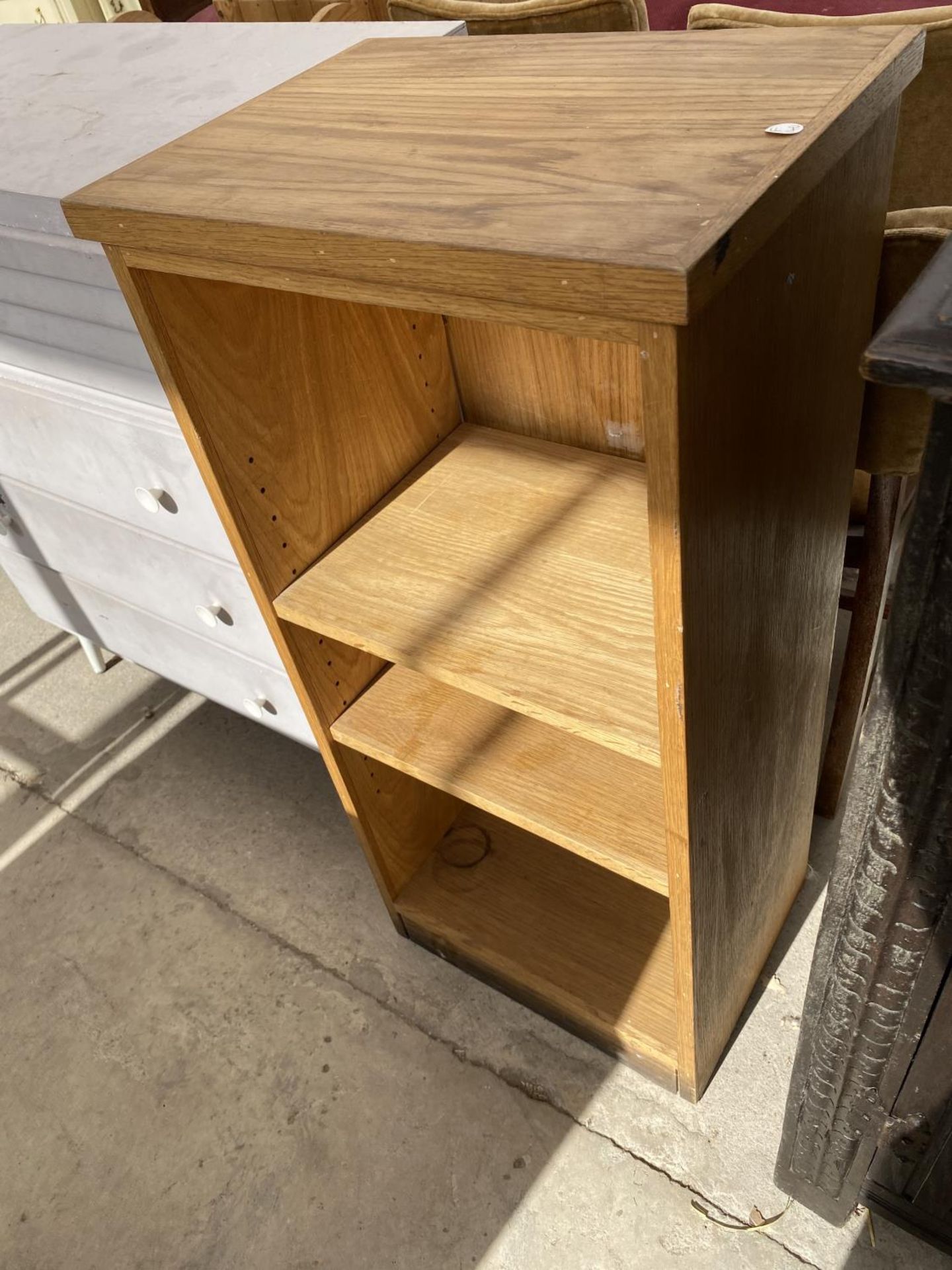 A SMALL PAINTED CHEST OF DRAWERS AND AN OPEN BOOKCASE - Image 3 of 3