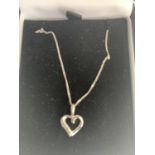 A BOXED 9 CARAT WHITE GOLD NECKLACE WITH HEART PENDANT