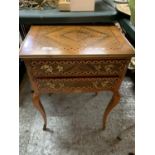 A TWO DRAWER TABLE, INLAID WITH BRASS ACCESSORIES