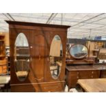 AN EDWARDIAN MAHOGANY AND INLAID MIRROR-DOOR WARDROBE AND DRESSING TABLE