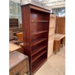 AN OPEN MAHOGANY VENEERED BOOKCASE