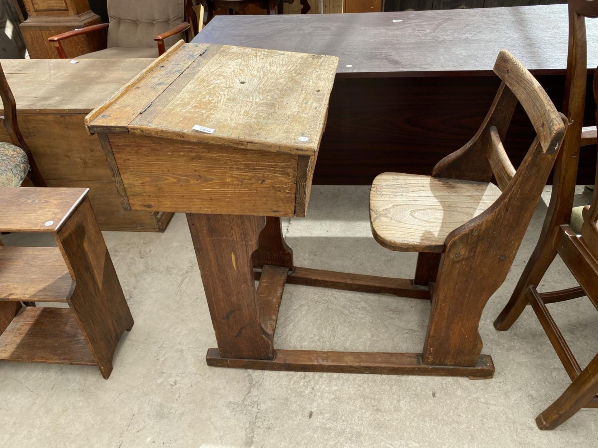 A VICTORIAN PITCH PINE SCHOOL DESK AND CHAIR