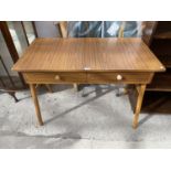 A RETRO TEAK EFFECT DESK WITH TWO DRAWERS