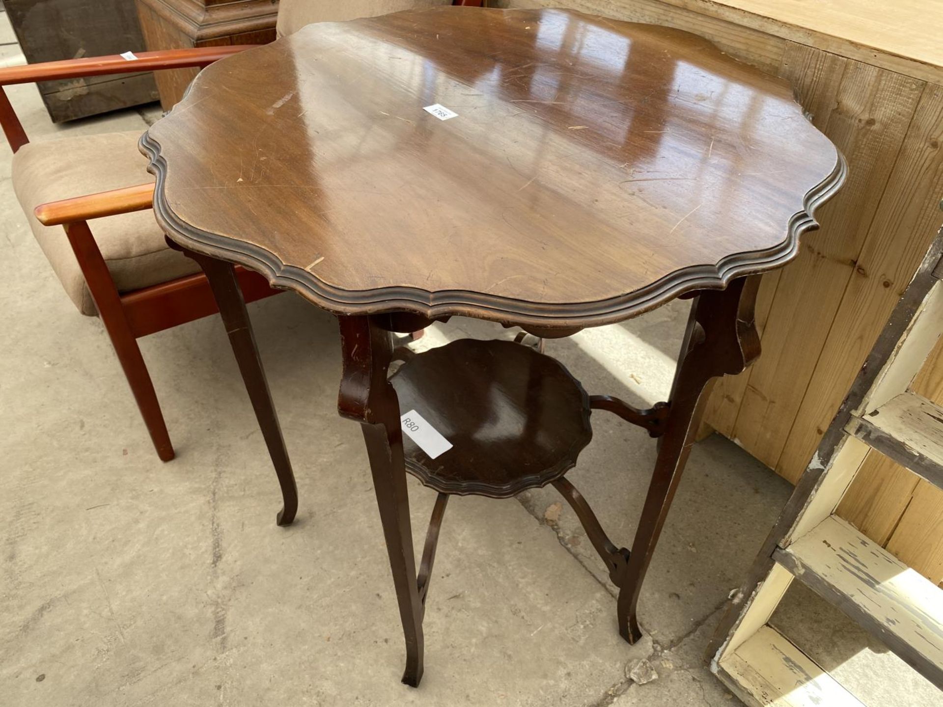 A MAHOGANY TWO TIER OCCASIONAL TABLE