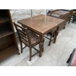 AN OAK DRAW LEAF TABLE AND TWO CHAIRS