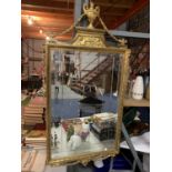 AN ORNATE GILT FRAMED MIRROR