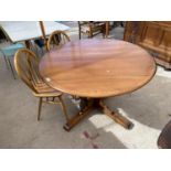 AN ELM ERCOL EXTENDING DINING TABLE AND PAIR OF ERCOL WINDSOR STYLE CHAIRS
