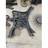 A PAIR OF VINTAGE CAST IRON BENCH ENDS