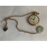 A YELLOW METAL INGERSOL TRIUMPH POCKET WATCH, FOB AND CHAIN