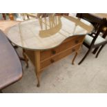 A KIDNEY SHAPED DRESSING TABLE