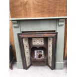 A VICTORIAN TILED BACK FIREPLACE WITH PAINTED PINE SURROUND