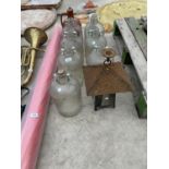 A VINTAGE LANTERN AND SEVEN DEMIJOHNS