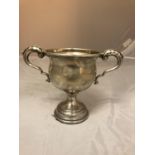 A SILVER HALLMARKED CUP WITH LOADED BASE, TOTAL WEIGHT 148G