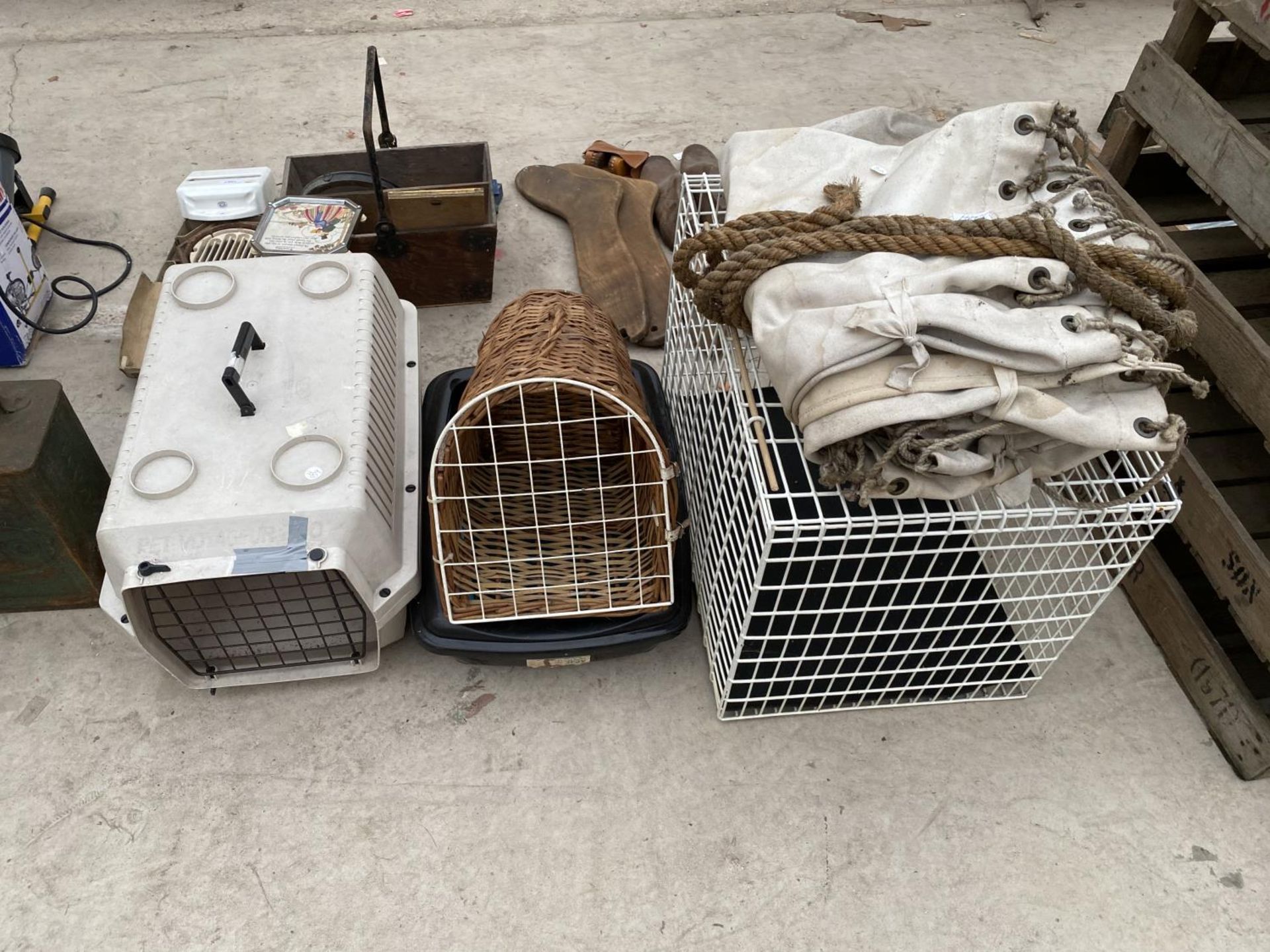 THREE PET CARRIERS AND A TARPAULIN SHEET