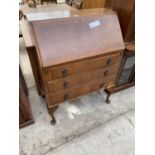 A SMALL WALNUT BUREAU ON CABRIOLE LEGS