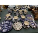 A THIRTY PIECE COLLECTION OF HAND-MADE BOLESLAWIEC POTTERY