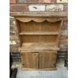 A SMALL PINE WALL DRESSER IN THE ARTS AND CRAFTS STYLE