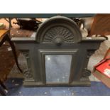 A HEAVY CAST METAL WALL MIRROR