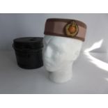 A BELGIUM FEMALE MILITARY HAT IN A TIN CASE