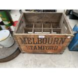 A VINTAGE WOODEN MELBOURN, STAMFORD BOTTLE CRATE