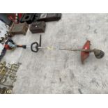 A PETROL STRIMMER - IN WORKING ORDER