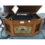 A VINTAGE STYLE TURNTABLE WITH RADIO AND CD PLAYER BELIEVED WORKING BUT NO WARRANTY