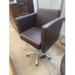 A MODERN SWIVEL OFFICE CHAIR ON FIVE PRONG BASE AND BOX ARMS