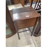 AN EARLY 20TH CENTURY OAK SEWING TABLE