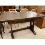 A REPRODUCTION OAK DRAW-LEAF REFECTORY STYLE DINING TABLE