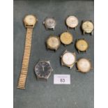 AN ASSORTMENT OF WHITE AND GOLD METAL WATCH FACES