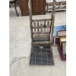 A VINTAGE WOODEN STEPLADDER AND A DOG CAGE