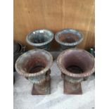 FOUR CAST IRON URN PLANT HOLDERS