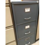 A THREE DRAWER METAL FILING CABINET AND A FURTHER FOUR DRAWER METAL FILING CABINET
