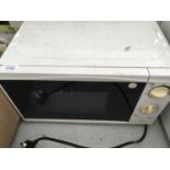 A WHITE MICROWAVE BELIEVED WORKING BUT NO WARRANTY