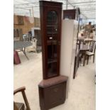 A MAHOGANY CORNER CABINET