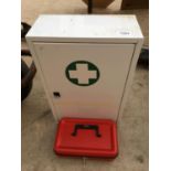 A METAL FIRST AID CABINET WITH CONTENTS AND A METAL CASH BOX WITH KEY