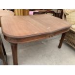 A TEAK DINING TABLE