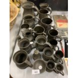 A LARGE QUANTITY OF PEWTER TANKARDS OF VARYING SIZES