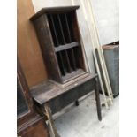 A WOODEN TABLE TOGETHER WITH A FURTHER WOODEN PIGEON HOLE STYLE CABINET