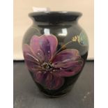 AN ANITA HARRIS HAND PAINTED AND SIGNED BLACK IRIS VASE