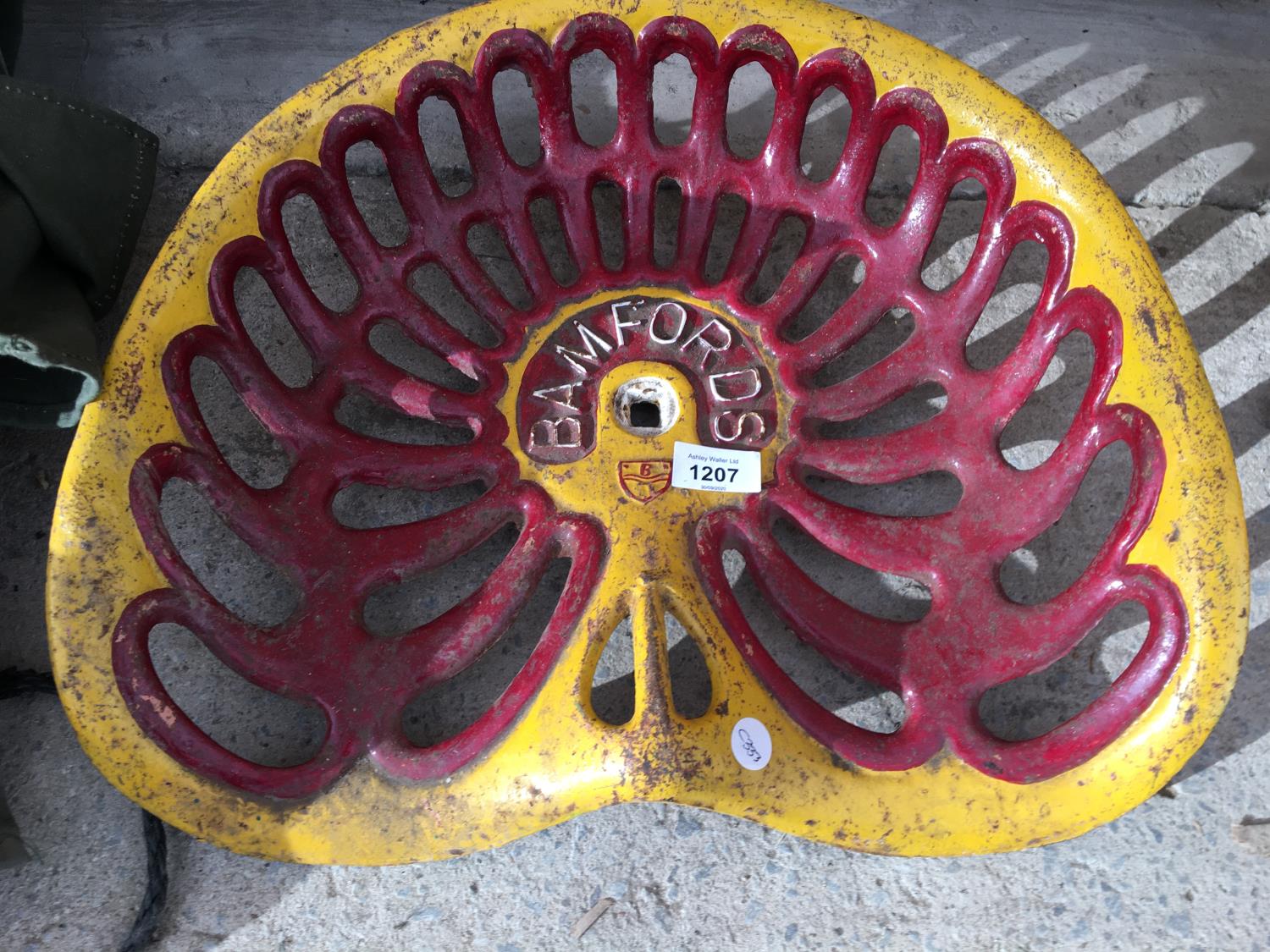 A BAMFORDS RED AND YELLOW TRACTOR SEAT