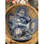 A BASKET OF NUMEROUS BLUE AND WHITE WEDGWOOD JASPERWARE ITEMS