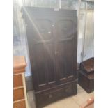 AN EARLY 20TH CENTURY JACOBEAN STYLE TWO DOOR WARDROBE, 40" WIDE