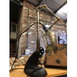 AN ANGLE POISE LAMP IN THE INDUSTRIAL STYLE