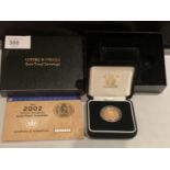 A 2002 GOLD PROOF SOVEREIGN IN WOODEN PRESENTATION BOX WITH CERTIFICATE