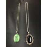 TWO SILVER NECKLACES, ONE BLACK AND ONE GREEN