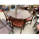 A STAG MAHOGANY EXTENDING DINING TABLE AND FOUR CHAIRS