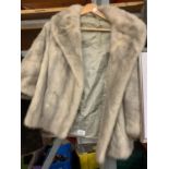 A SHORT GREY FUR LADIES JACKET