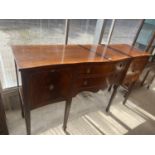 A REGENCY STYLE MAHOGANY SERPENTINE FRONTED SIDEBOARD ON TAPERED LEGS, 63" WIDE